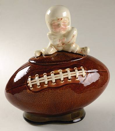 Boy on Football by Nelson McCoy