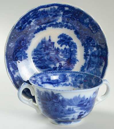 Non Pareil (Flow Blue) Footed Bouillon Cup & Saucer