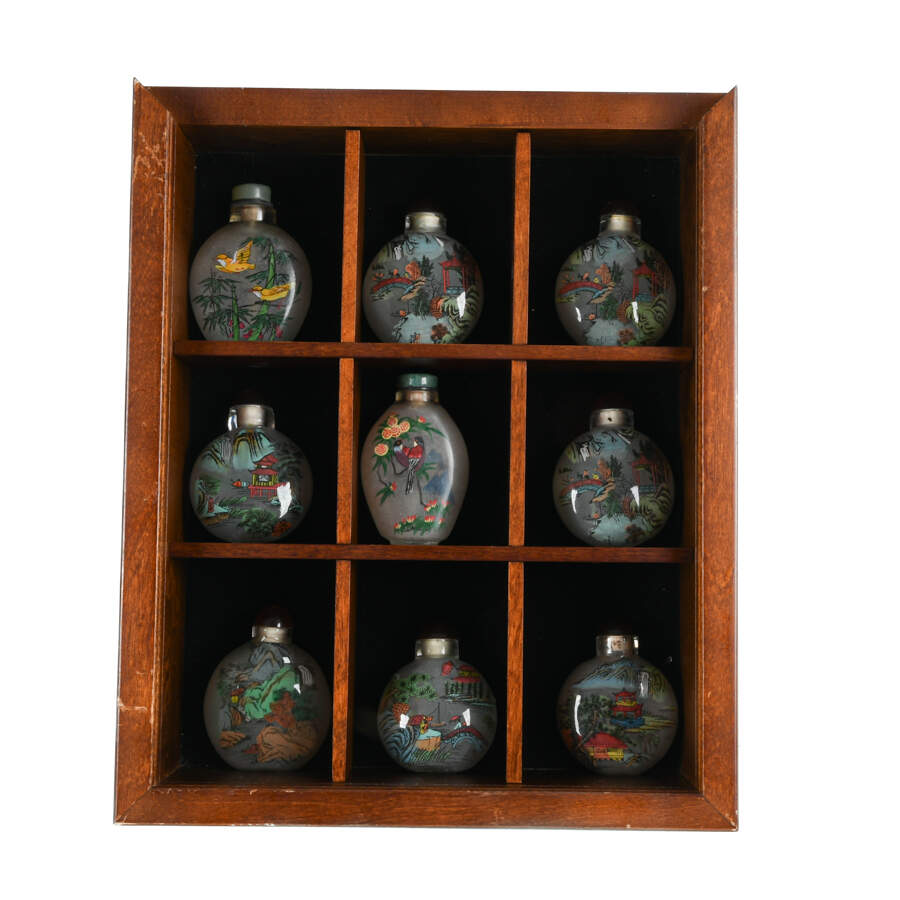Collection of Chinese Reverse-Painted Snuff Bottles in a Display Case-2