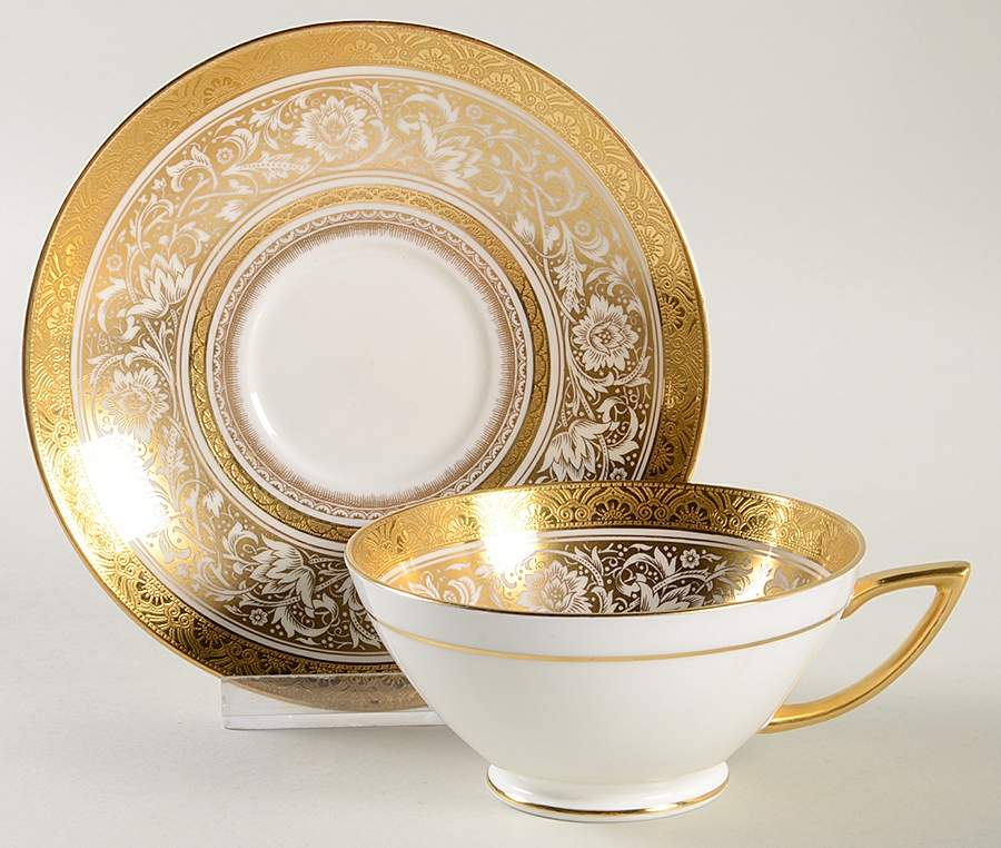 Porcelain Ball Ivory Footed Cup & Saucer Set by Minton-1