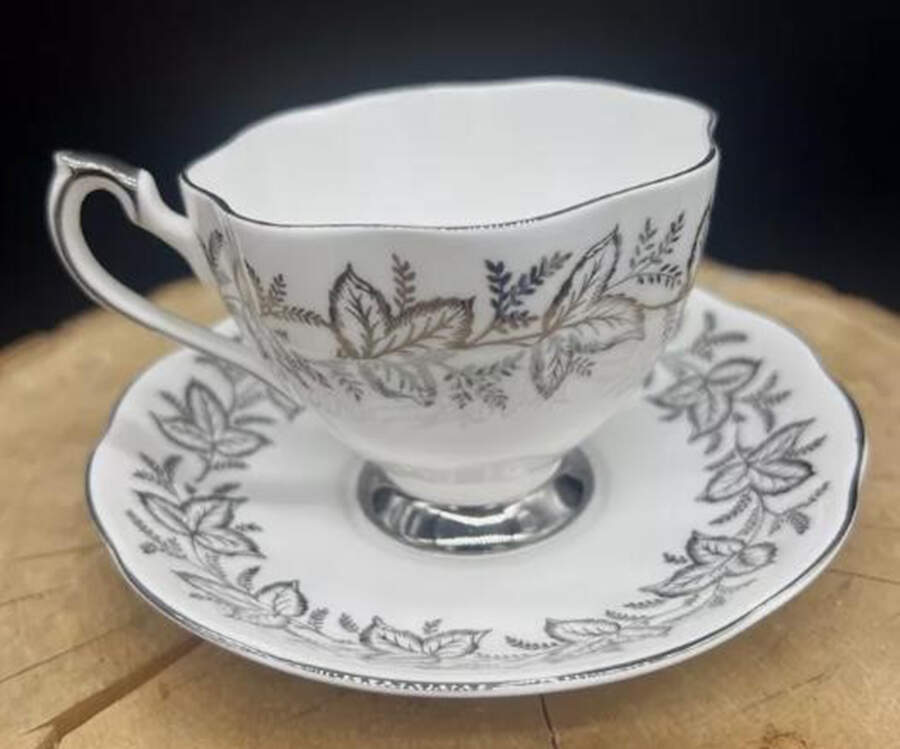 Ailsa Platinum Footed Cup & Saucer Set by Queen Anne (England)-1