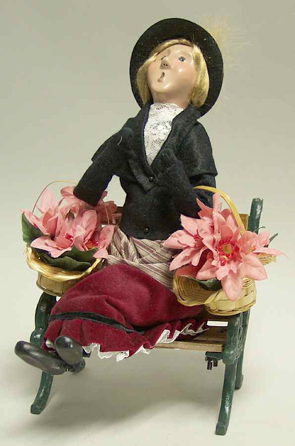 Traditional Assorted Carolers Woman With Poinsettias On Bench - No Box by Byers' Choice Ltd-1