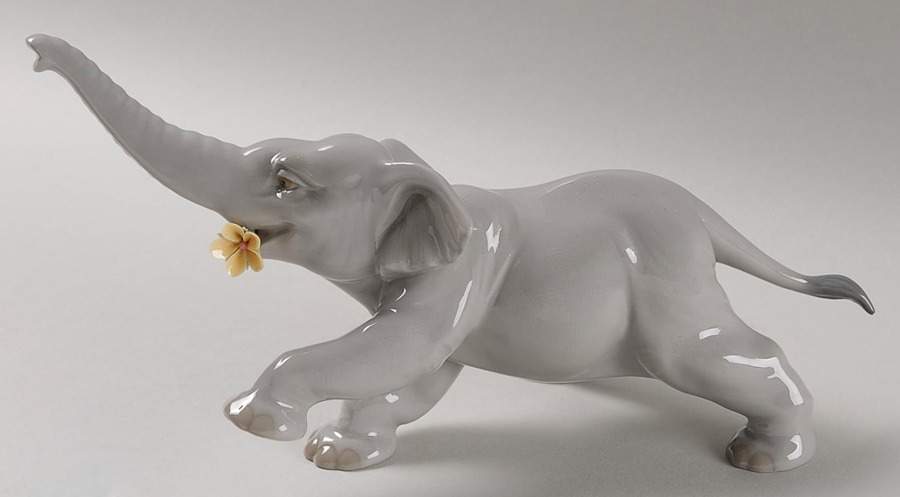 Animals-Wild Baby Elephant With Yellow Flower - Boxed by Lladro-1