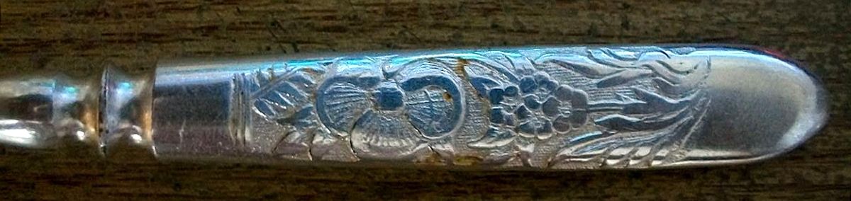Embossed (Silverplate, 1882) Indented Solid Handle Fork by International Silver-1