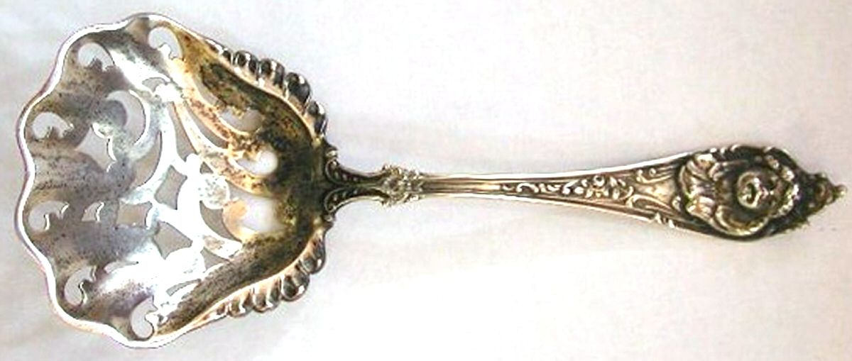 Cherub (Sterling, 1895) Pierced Almond Spoon by Watson-1