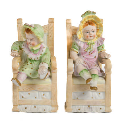 Pair of German Bisque Seated Children Figures