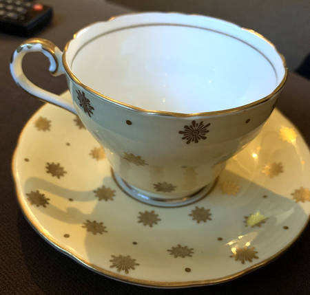 130 7 Footed Cup & Saucer Set