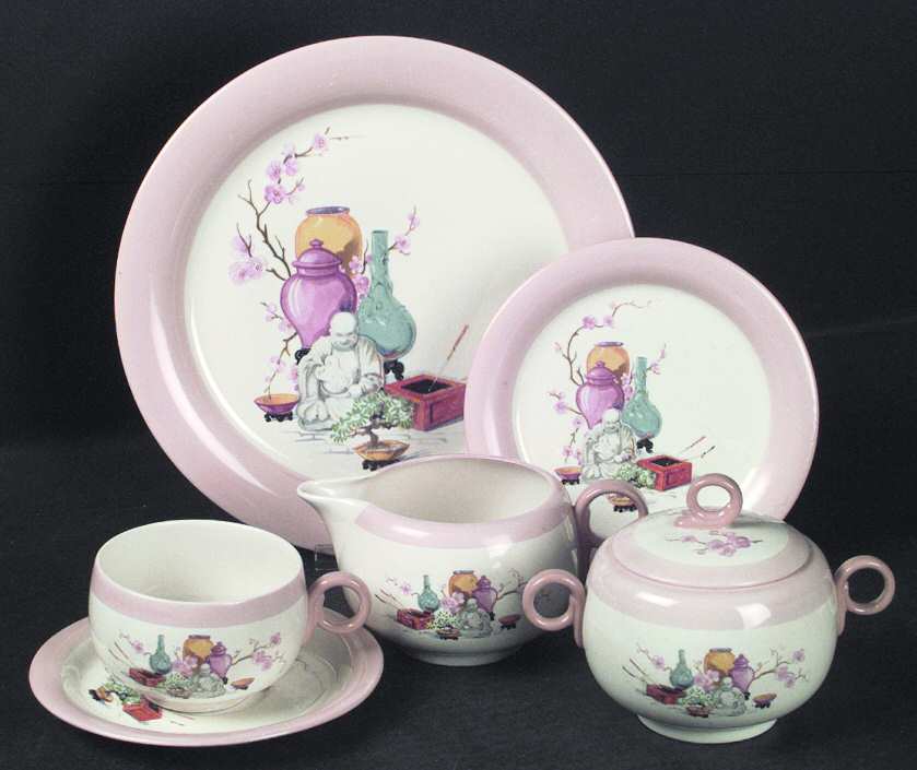 Chinese Buddha Flat Cup & Saucer Set
