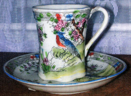 PAQ1 Chocolate Cup & Saucer Set