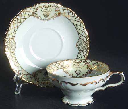 Golden Symphony (L & M) Footed Cup & Saucer Set