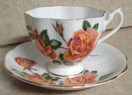 Sutters Gold Footed Cup & Saucer Set