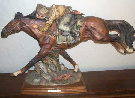 A Santini Sculptures Cowboy On Galloping Horse - No Box