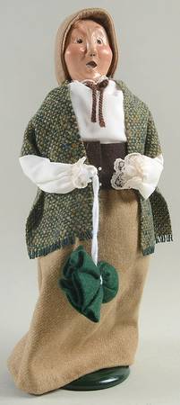 Traditional Assorted Carolers Woman With Green Bag-Brown Skirt And Hat - No Box
