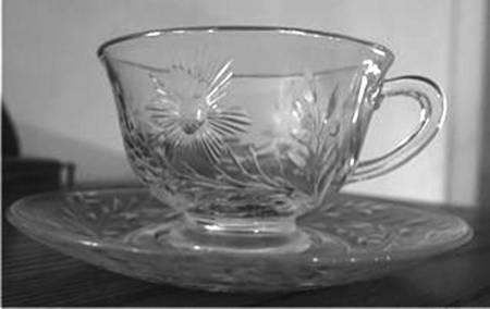 3389 9 Footed Cup & Saucer Set