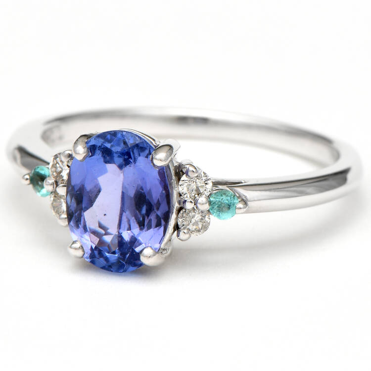 18KW Tanzanite (1.25) Diamond (0.08) & Paraiba Tourmaline (0.04) Ring