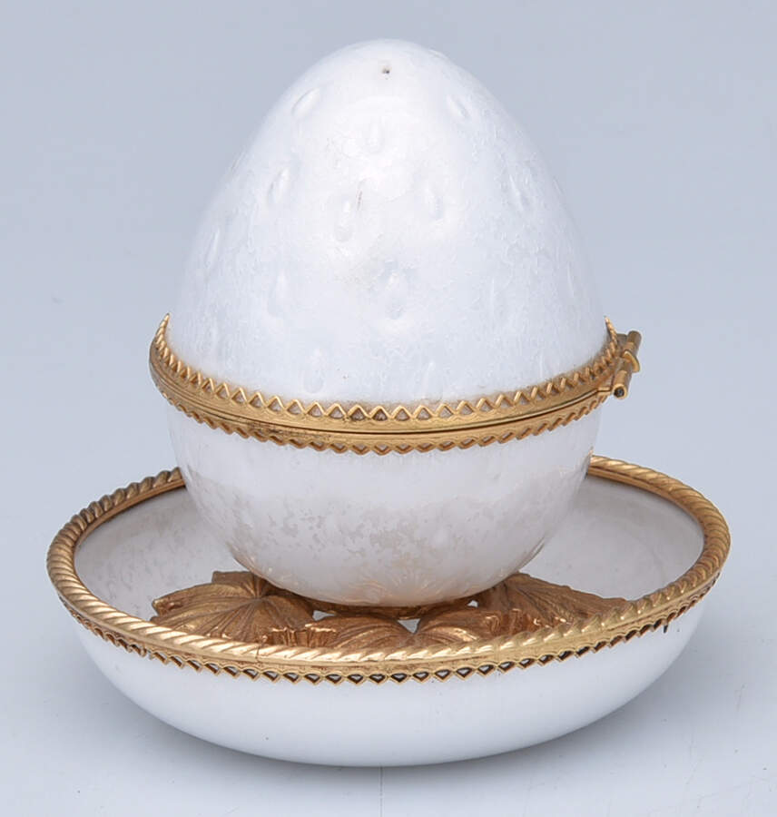 An Evans enamelware guilloche table lighter and underplate listed at $149.95 in September 2026